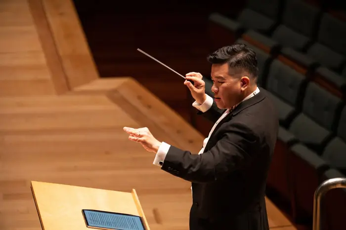 Conductor leading the VENTUS wind band at SIBF 2024, Esplanade Concert Hall